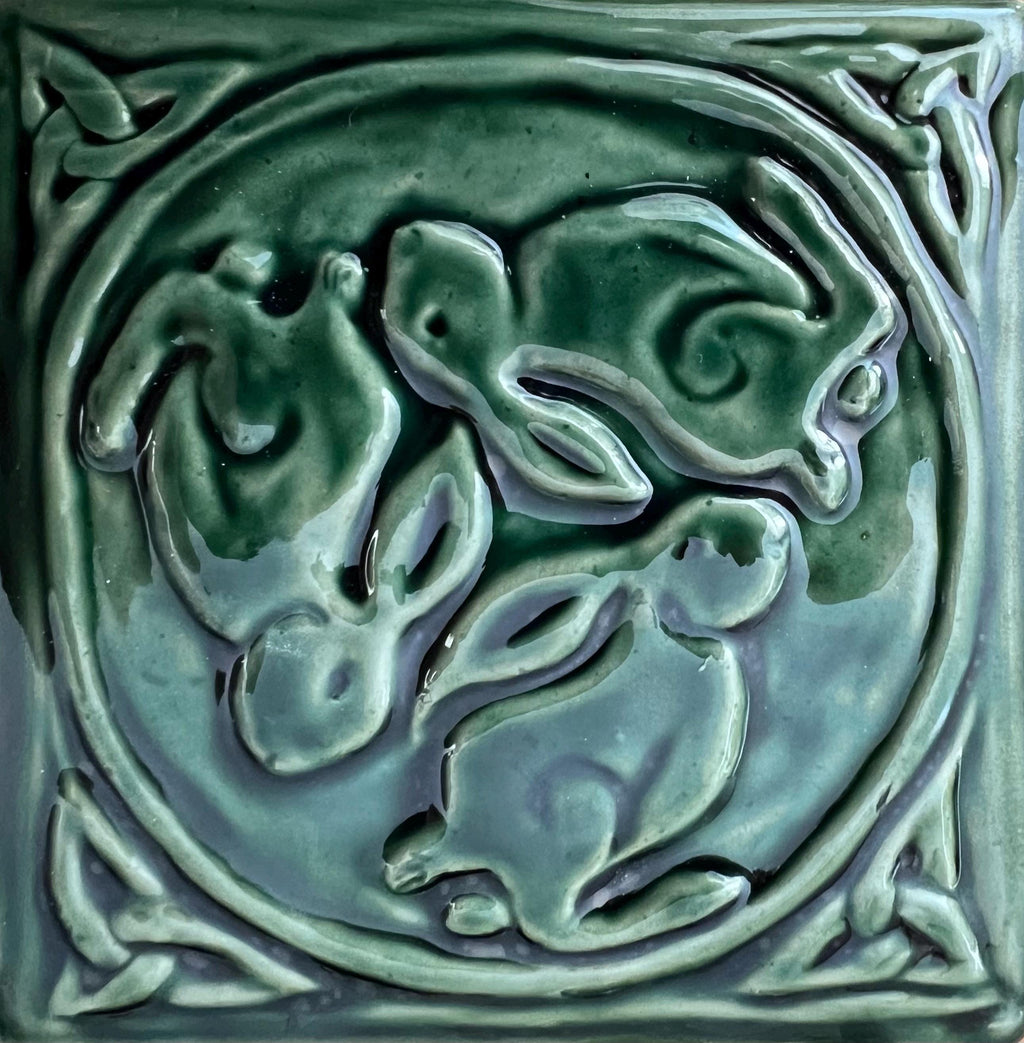 6"Crackle blue Celtic bunnies ceramic tile in stoneware clay .