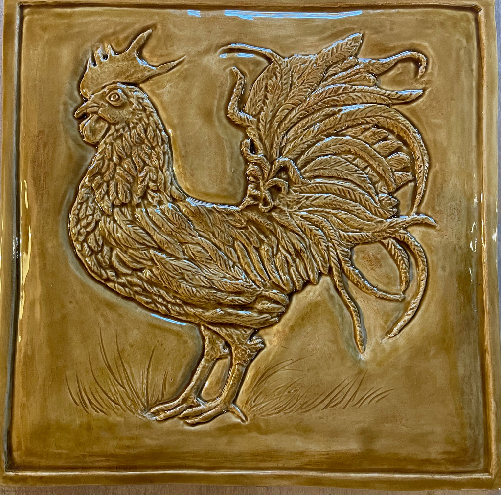 Ceramic bas relief cockerel backsplash in wheat glaze and celtic knot border.