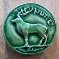 Round ceramic bas-relief  Tile deer inspired by the old Irish coin collection.