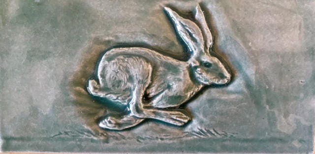 Set of three Running Hare Subway feature tiles in a soft Green /Grey Glaze