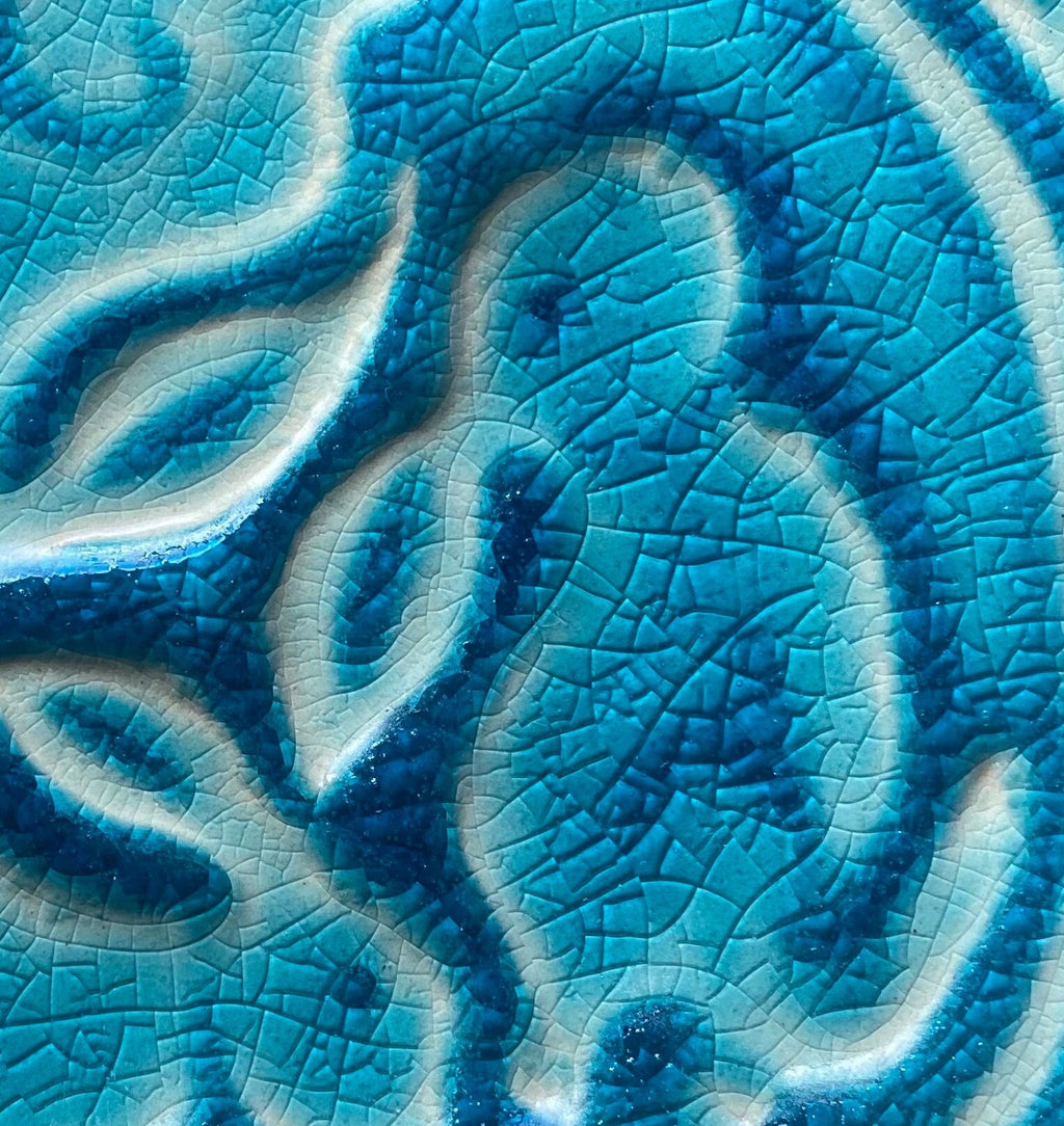 4"Crackle blue Celtic bunnies ceramic tile in stoneware clay .